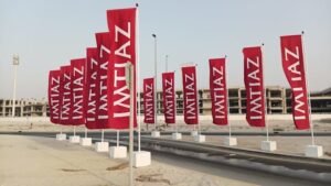 Custom outdoor advertising flags installed for a commercial project with professional Flag Printing Dubai services.