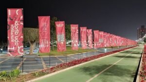 Custom promotional event flags installed along a boulevard using professional Flag Printing Dubai services.